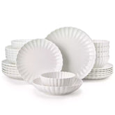 Adonis 24 piece white porcelain dinnerware set for 6 styled with pasta soup and fruit on a modern dining table