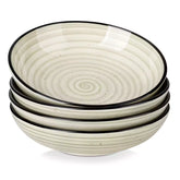Bonbon stoneware pasta bowls in beige with spiral speckled glaze on a styled dining table