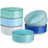 Blue Bonita straight-edge cereal bowls set of 6 on a white table - filled with oats - pear - and pasta - accented with lemons and greenery for a fresh - natural look