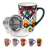 Lumi forest green porcelain tea mug with infuser and lid featuring vibrant Bohemian pattern on a wooden desk with laptop and plant