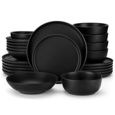 A matte black 24-piece stoneware dinnerware set from the Playa collection by vancasso - adding a modern flair with plates and bowls for 6 people