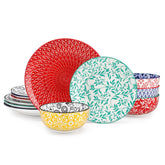 Selene porcelain 12 piece dinnerware set service for 4 vibrant floral geometric plates bowls flat lay with cutlery