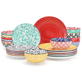 Selene porcelain 24 piece dinnerware set vibrant floral leaf pattern plates lifestyle serving scene with food