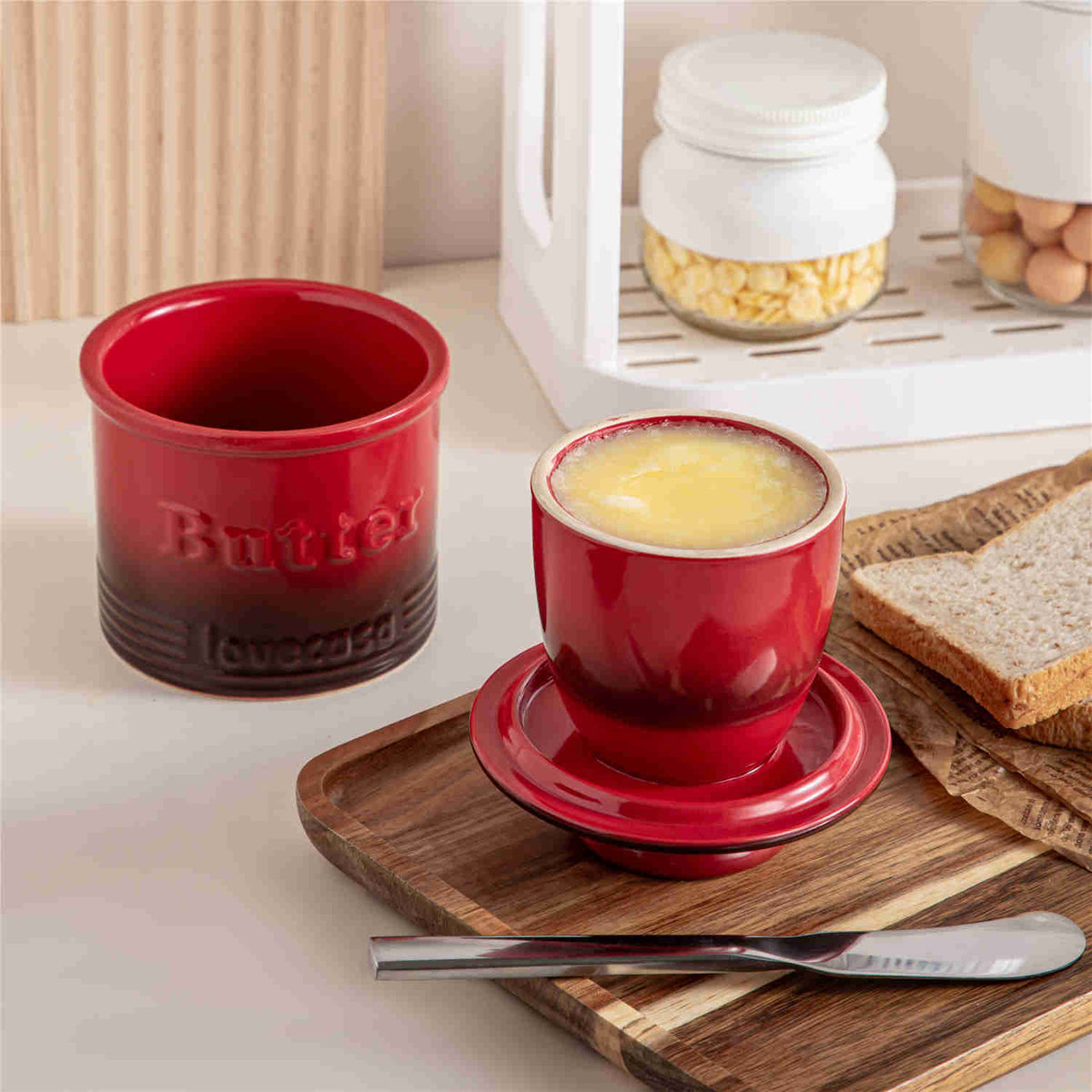 Red Stoneware French Butter Crock With Water Line, Combining Traditional Design And Temperature Control For Fresh, Spreadable Butter.