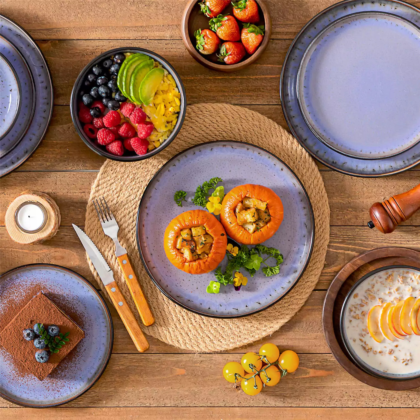 Amber 12 Piece Dinnerware Set in vibrant purple tones, beautifully arranged with chocolate mousse, roasted pumpkin rolls, oatmeal, and fresh fruit on a rustic brown wooden table.