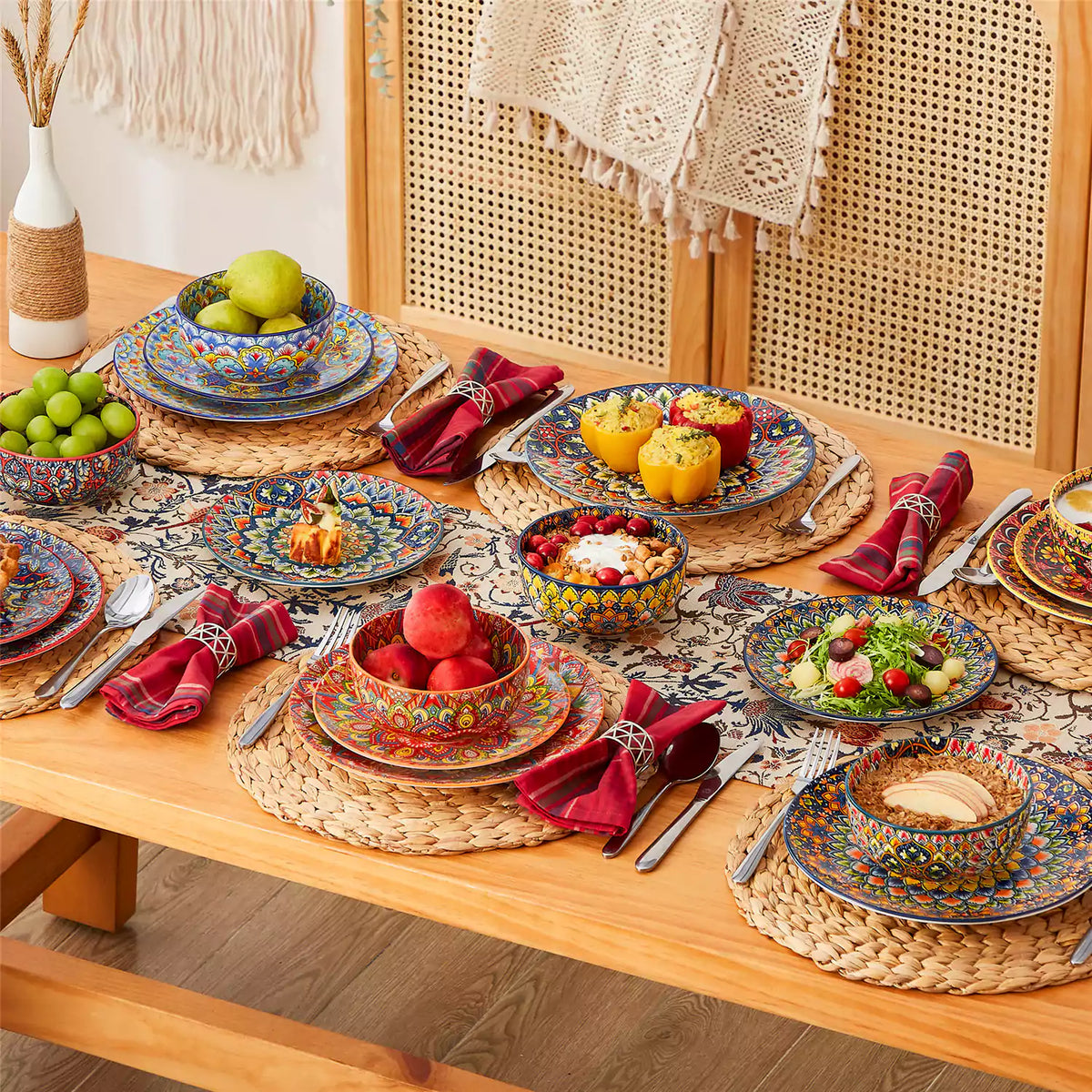 Lumi 18-piece dinnerware set with double-sided bowls on bohemian table, decorated with fresh fruit, oats, and colorful foods.