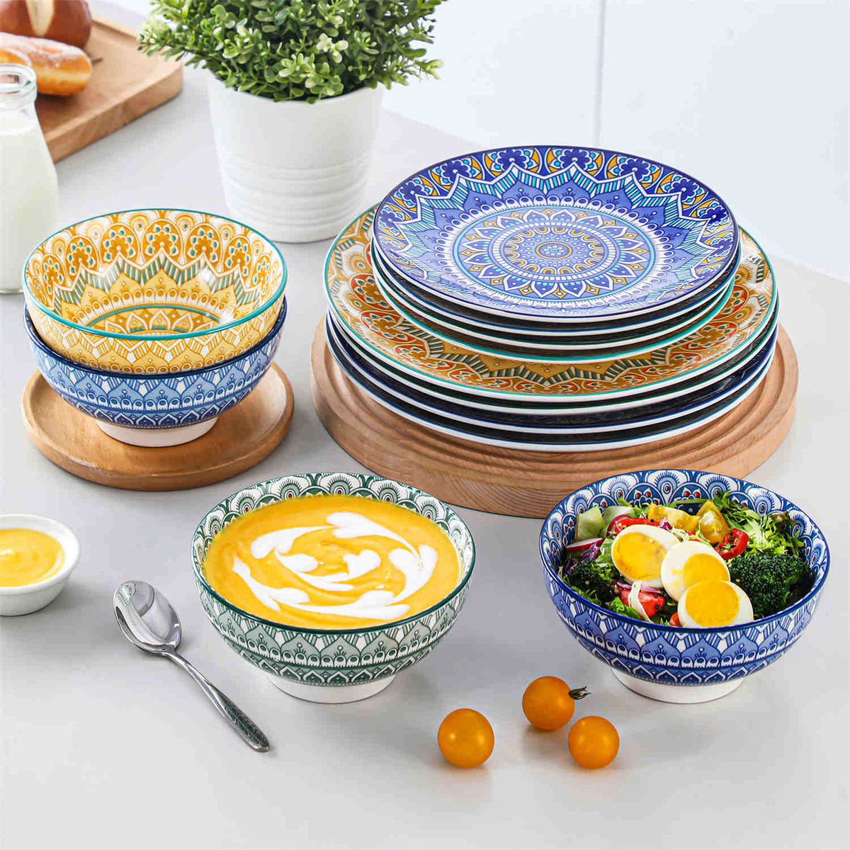Bohemian Mandala dinnerware stacked with vibrant Persian blue, yellow, green, and turquoise patterns, served with fresh fruit and vegetable salad
