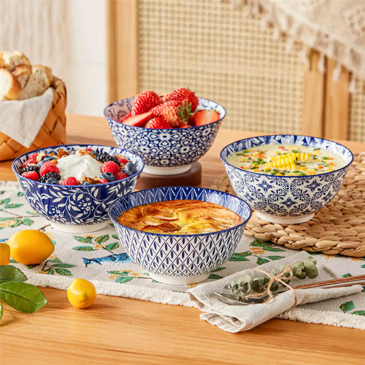 Selene stoneware cereal bowls set of 4 with berry yogurt ice cream, soup and linen napkins on botanical table runner.