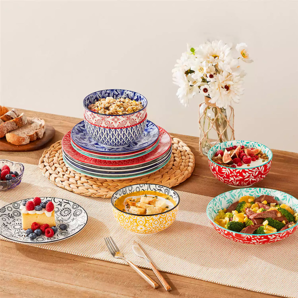 Selene mix and match porcelain dinnerware stacked with salad bowl berry yogurt bowl bread plate beige table runner Japanese inspired.