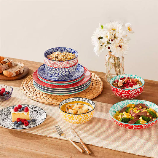Selene mix and match porcelain dinnerware stacked with salad bowl berry yogurt bowl bread plate beige table runner Japanese inspired.