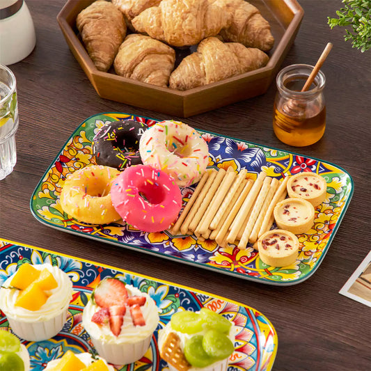 Simi porcelain serving platters set of 3 with desserts snacks cupcakes and wooden bread board on dark brown wood dining table Bohemian pattern.