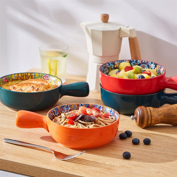 Simi Boho porcelain 4 piece 23oz soup bowls with handles holding pasta and baked cake with fruit on wooden table.