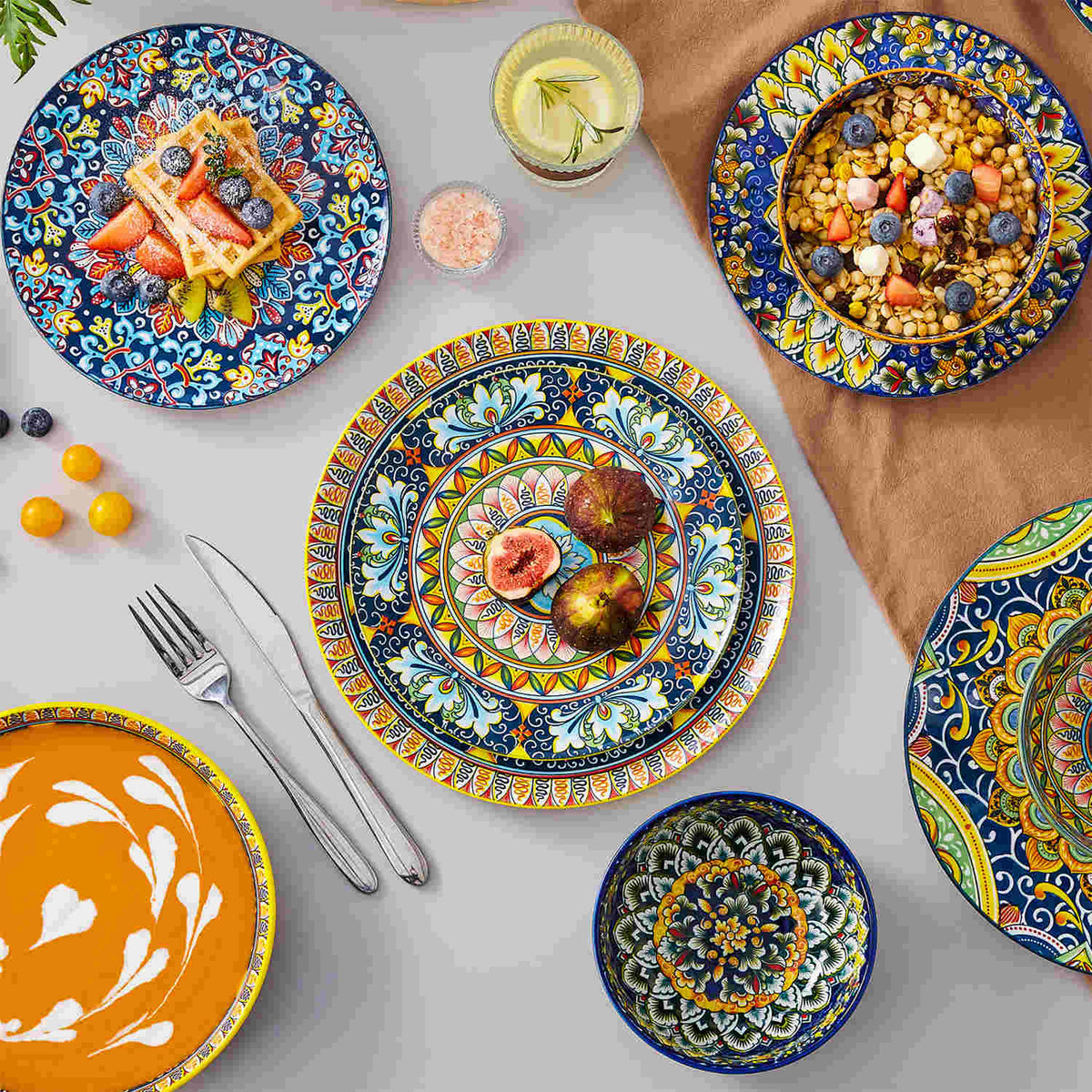 Bohemian-style dinnerware with six rich patterns, styled with figs and oats