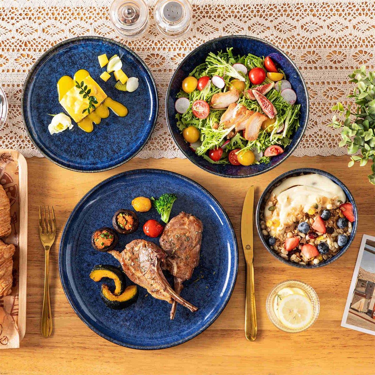 Starry stoneware dinner plate with a solo meal spread on a lace table runner and natural wood dining table.