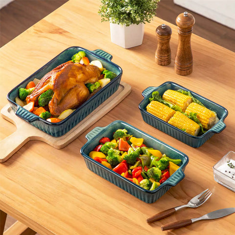 Starry 3 piece stoneware bakeware set with reactive glaze in green on a wooden table