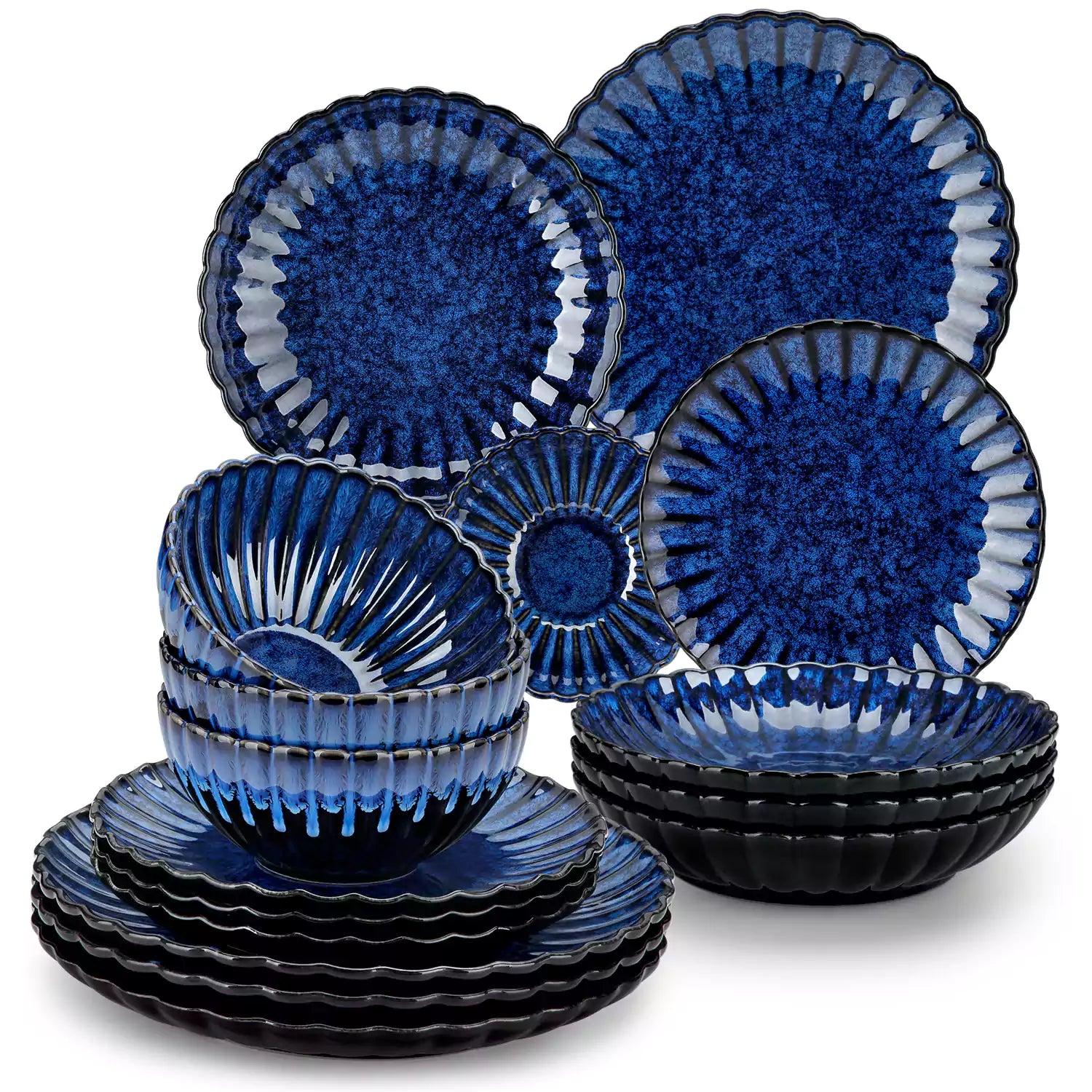 Adonis 16 piece reactive glaze dinnerware set in teal blue with pasta steak and fruit on a wooden dining table