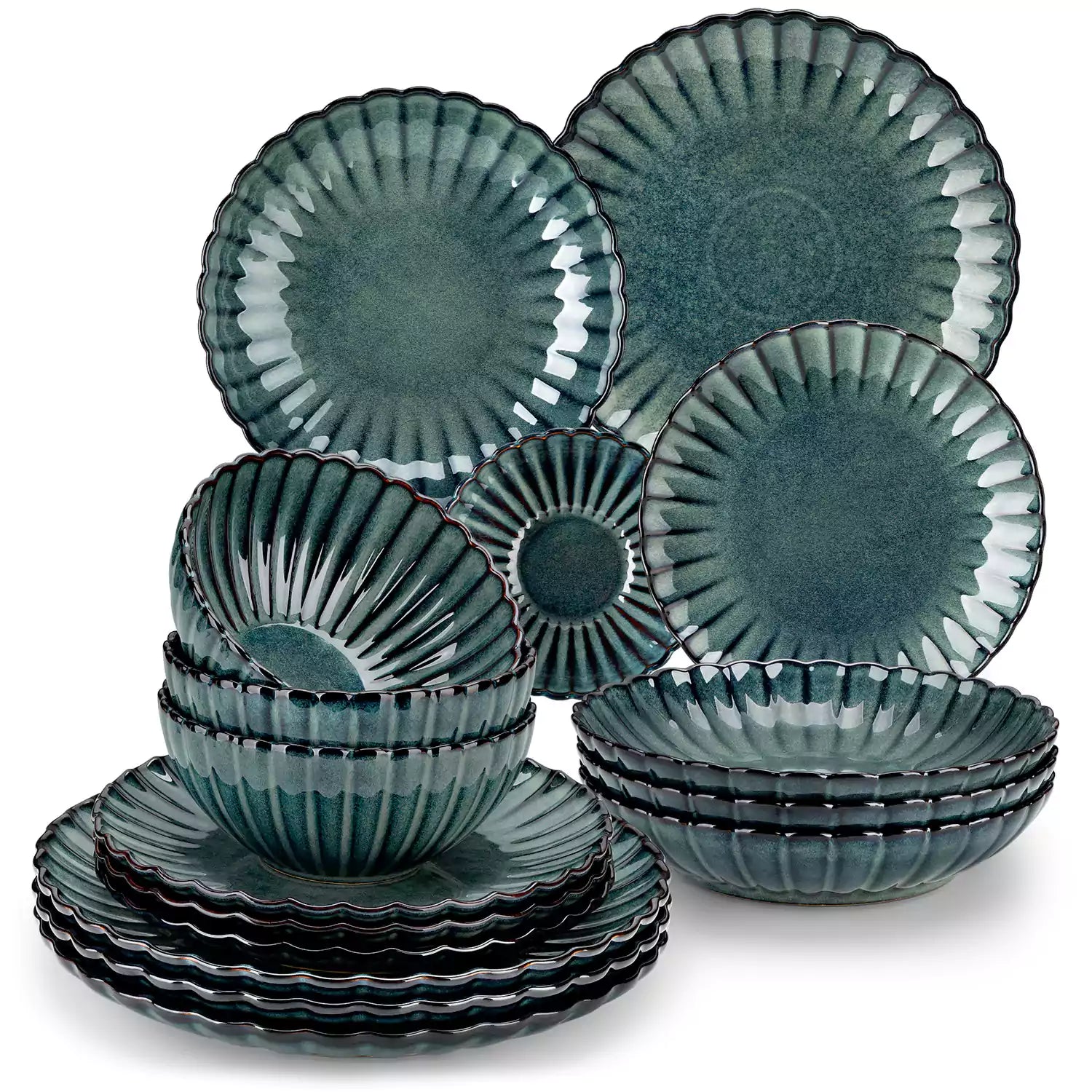 Adonis 16 piece reactive glaze dinnerware set in teal green with pasta steak and fruit on a wooden dining table