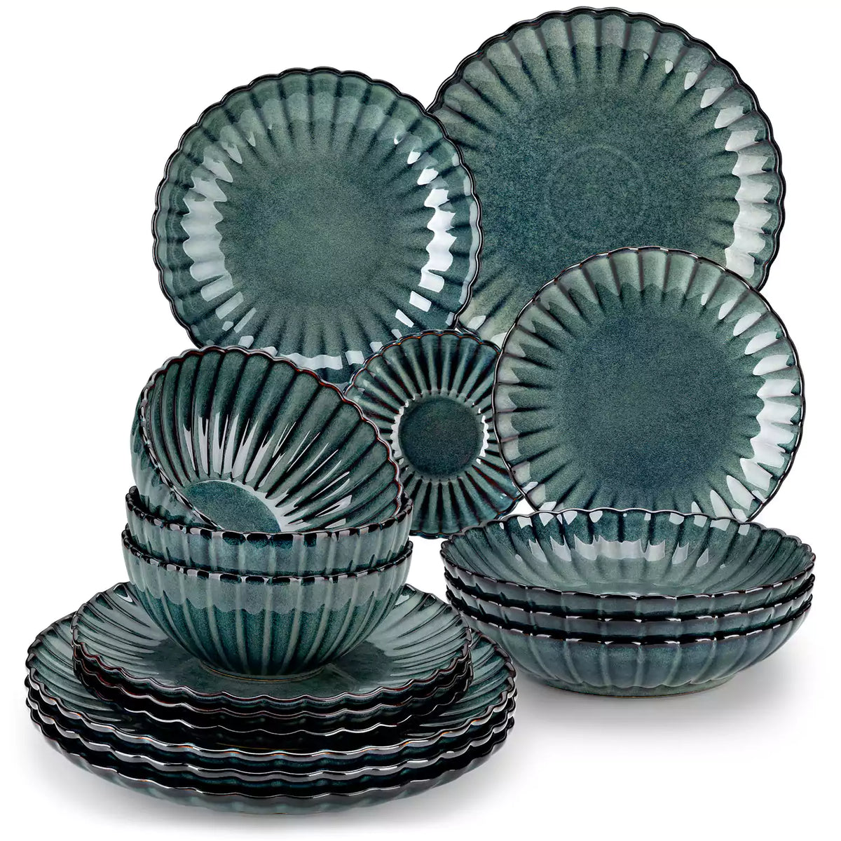Adonis 16 piece reactive glaze dinnerware set in teal green with pasta steak and fruit on a wooden dining table