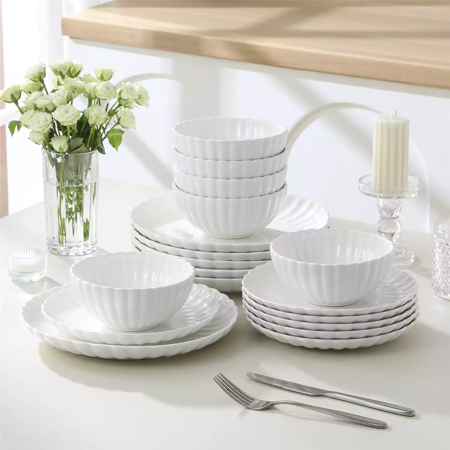 Adonis 18 piece white porcelain dinnerware set styled with food and glassware on a modern dining table