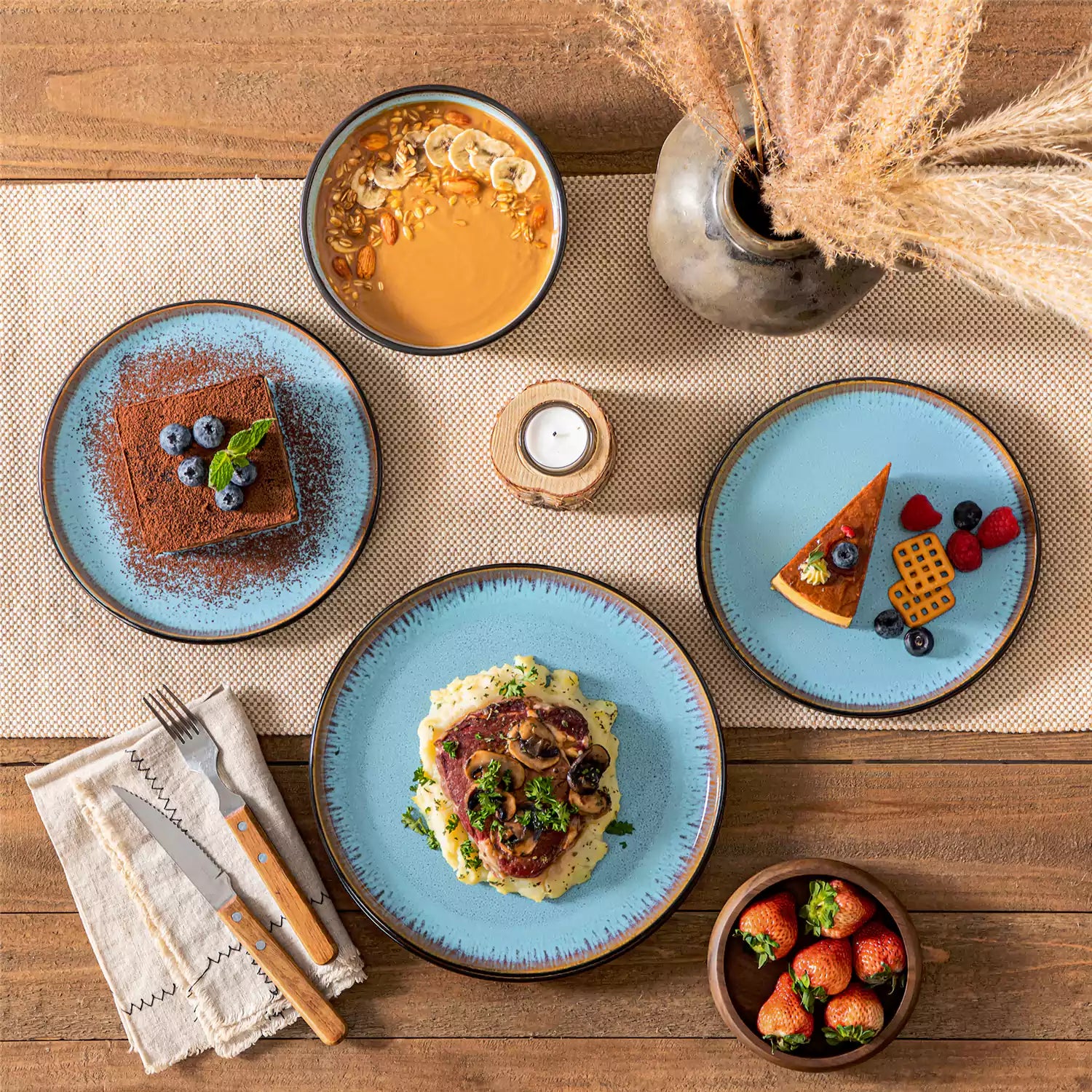 Rustic dining table with Amber 12-piece stoneware dinnerware in farmhouse blue - featuring reactive glaze plates - bowls - and utensils by vancasso