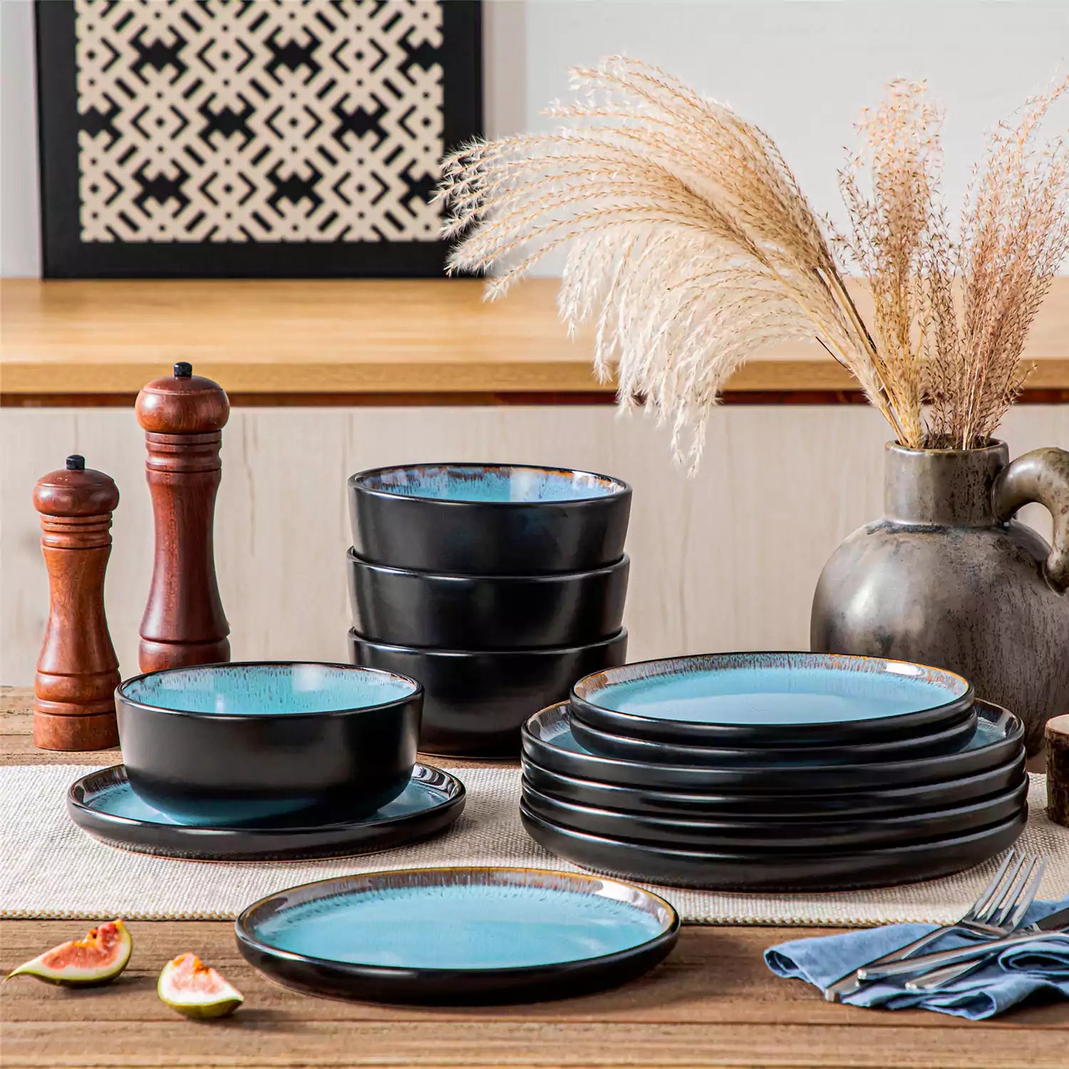 Rustic dining table with Amber 12-piece stoneware dinnerware in farmhouse blue - featuring reactive glaze plates - bowls - and utensils by vancasso