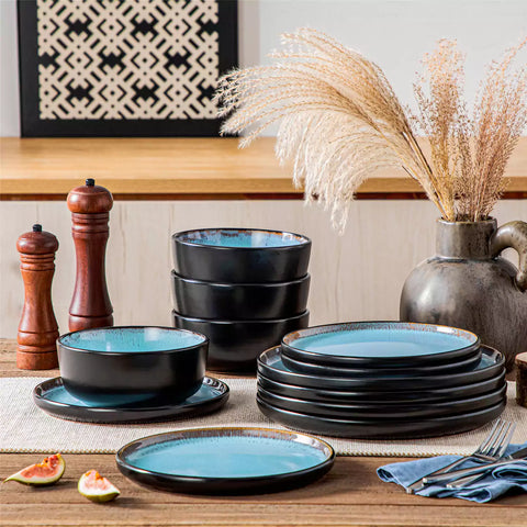 Rustic dining table with Amber 12-piece stoneware dinnerware in farmhouse blue - featuring reactive glaze plates - bowls - and utensils by vancasso
