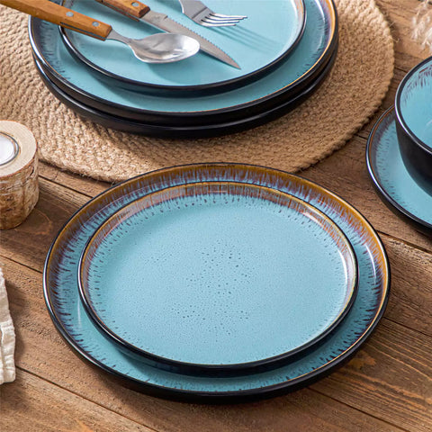 Rustic dining table with Amber 12-piece stoneware dinnerware in farmhouse blue - featuring reactive glaze plates - bowls - and utensils by vancasso