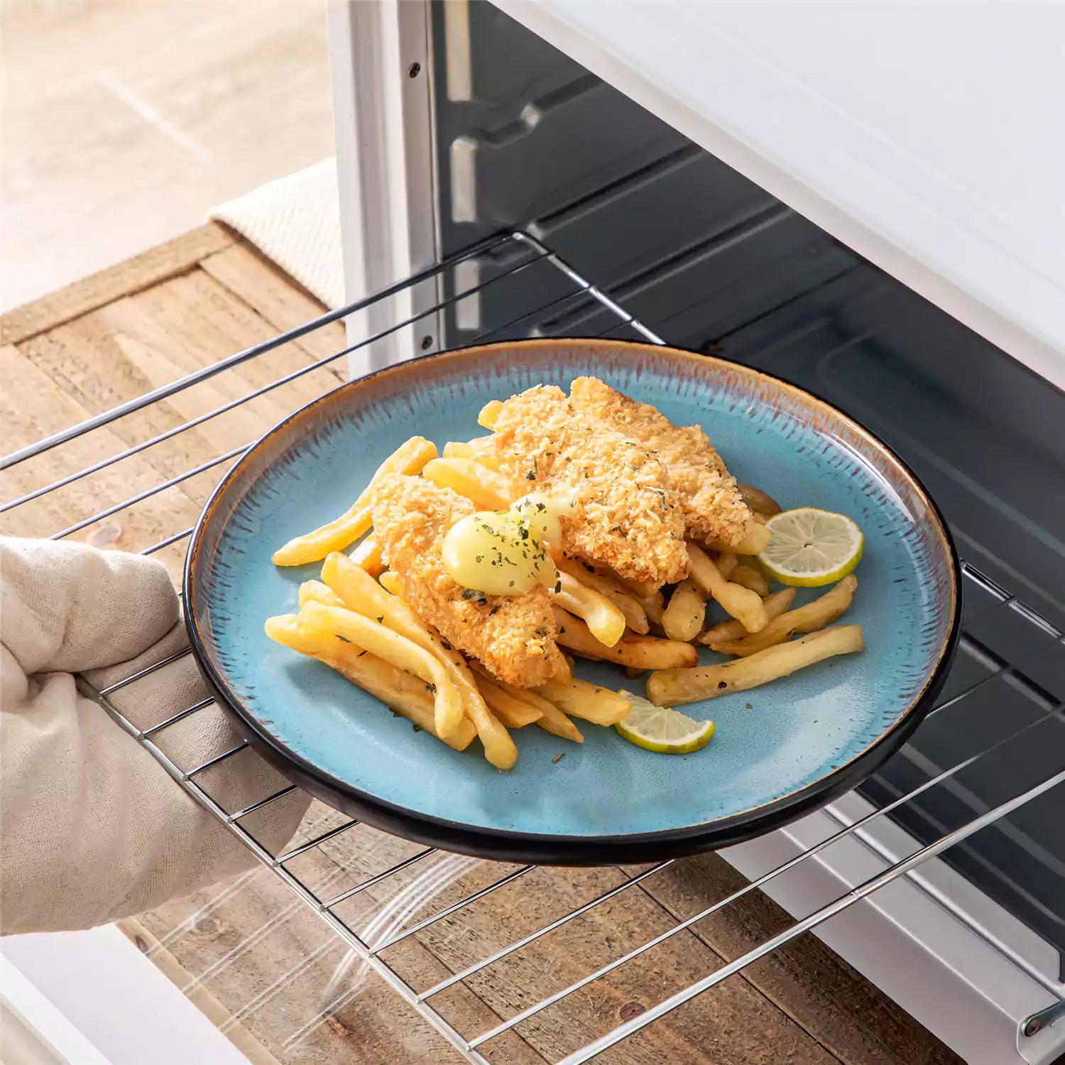 Assorted dishes with soup - dessert - and fruit salad on rustic wooden table - Amber 16-Piece blue stoneware dinnerware set with plates and bowls by vancasso