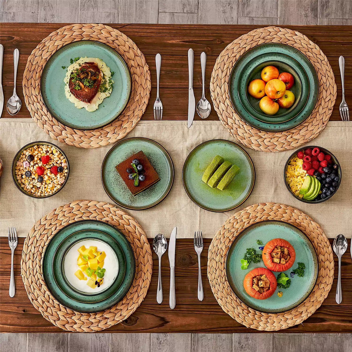 Rustic dining table with Amber 12-piece stoneware dinnerware in farmhouse green - featuring reactive glaze plates - bowls - and utensils by vancasso