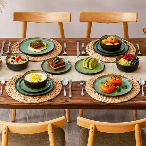 Rustic dining table with Amber 12-piece stoneware dinnerware in farmhouse green - featuring reactive glaze plates - bowls - and utensils by vancasso