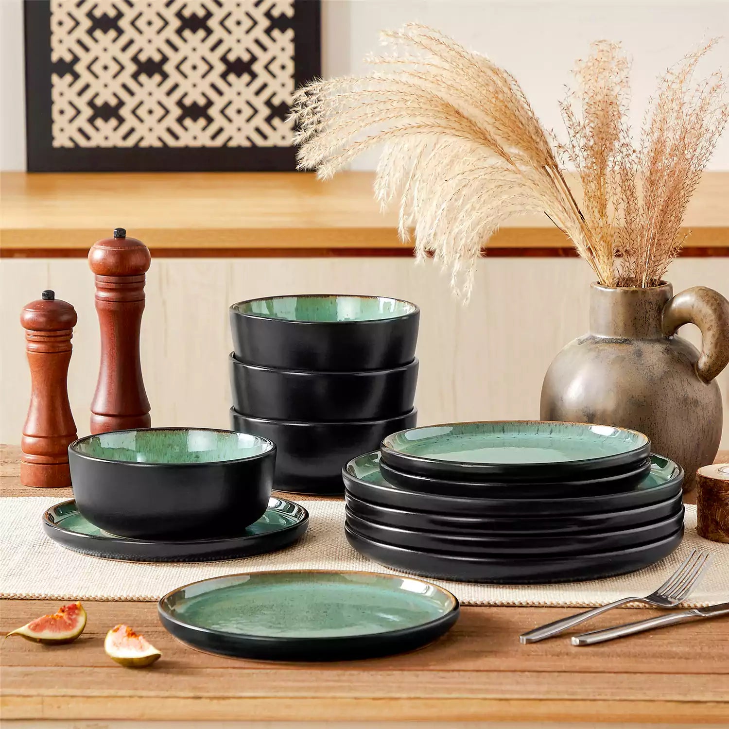 Rustic dining table with Amber 12-piece stoneware dinnerware in farmhouse green - featuring reactive glaze plates - bowls - and utensils by vancasso