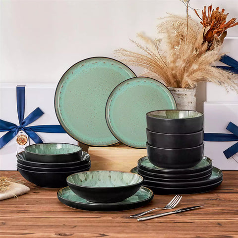 Assorted dishes with soup - dessert - and fruit salad on rustic wooden table - Amber 16-Piece green stoneware dinnerware set with plates and bowls by vancasso