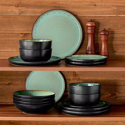 Assorted dishes with soup - dessert - and fruit salad on rustic wooden table - Amber 16-Piece green stoneware dinnerware set with plates and bowls by vancasso