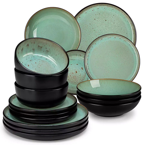 Assorted dishes with soup - dessert - and fruit salad on rustic wooden table - Amber 16-Piece green stoneware dinnerware set with plates and bowls by vancasso