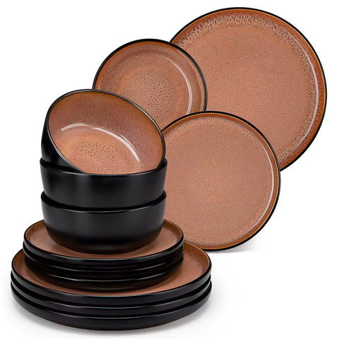 Rustic dining table with Amber 12-piece stoneware dinnerware in farmhouse red - featuring reactive glaze plates - bowls - and utensils by vancasso