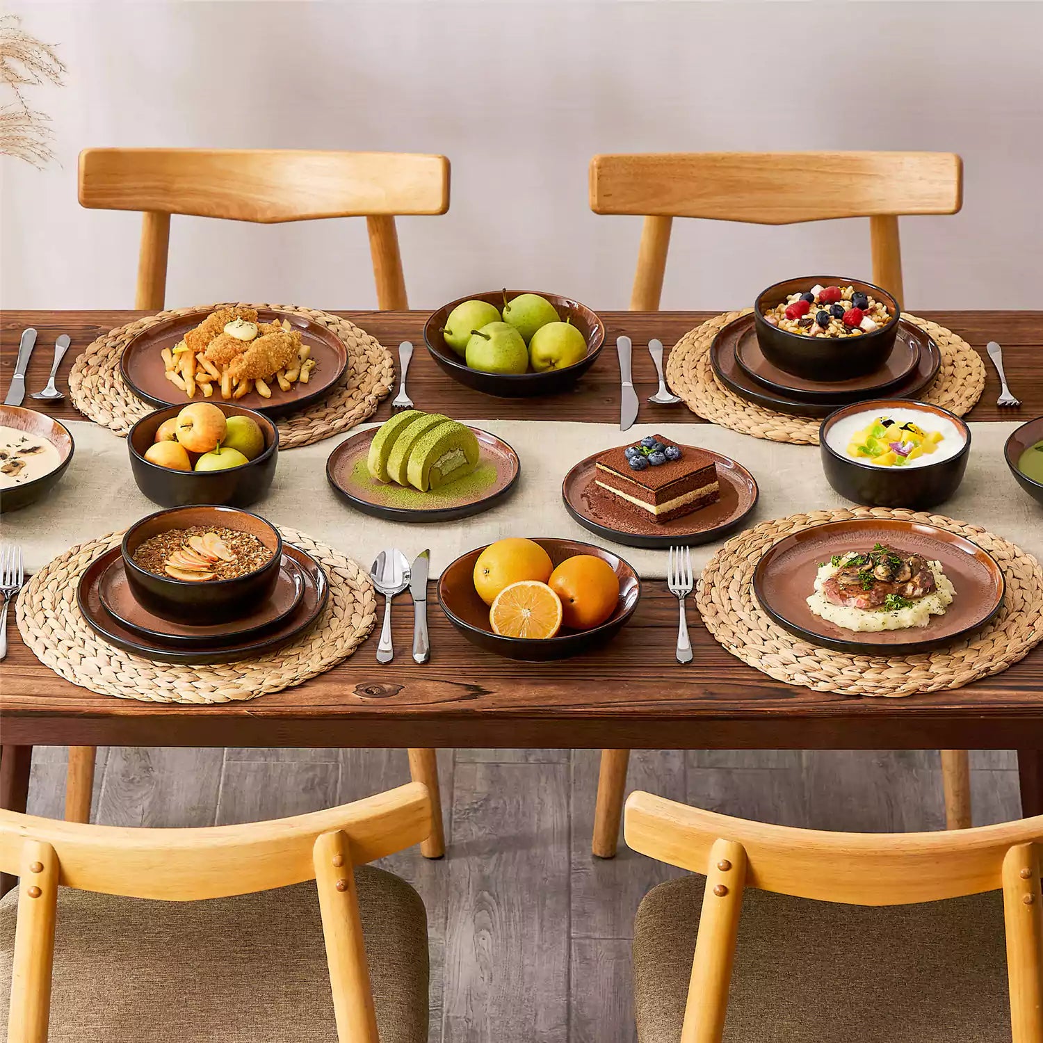 Assorted dishes with soup - dessert - and fruit salad on rustic wooden table - Amber 16-Piece red stoneware dinnerware set with plates and bowls by vancasso