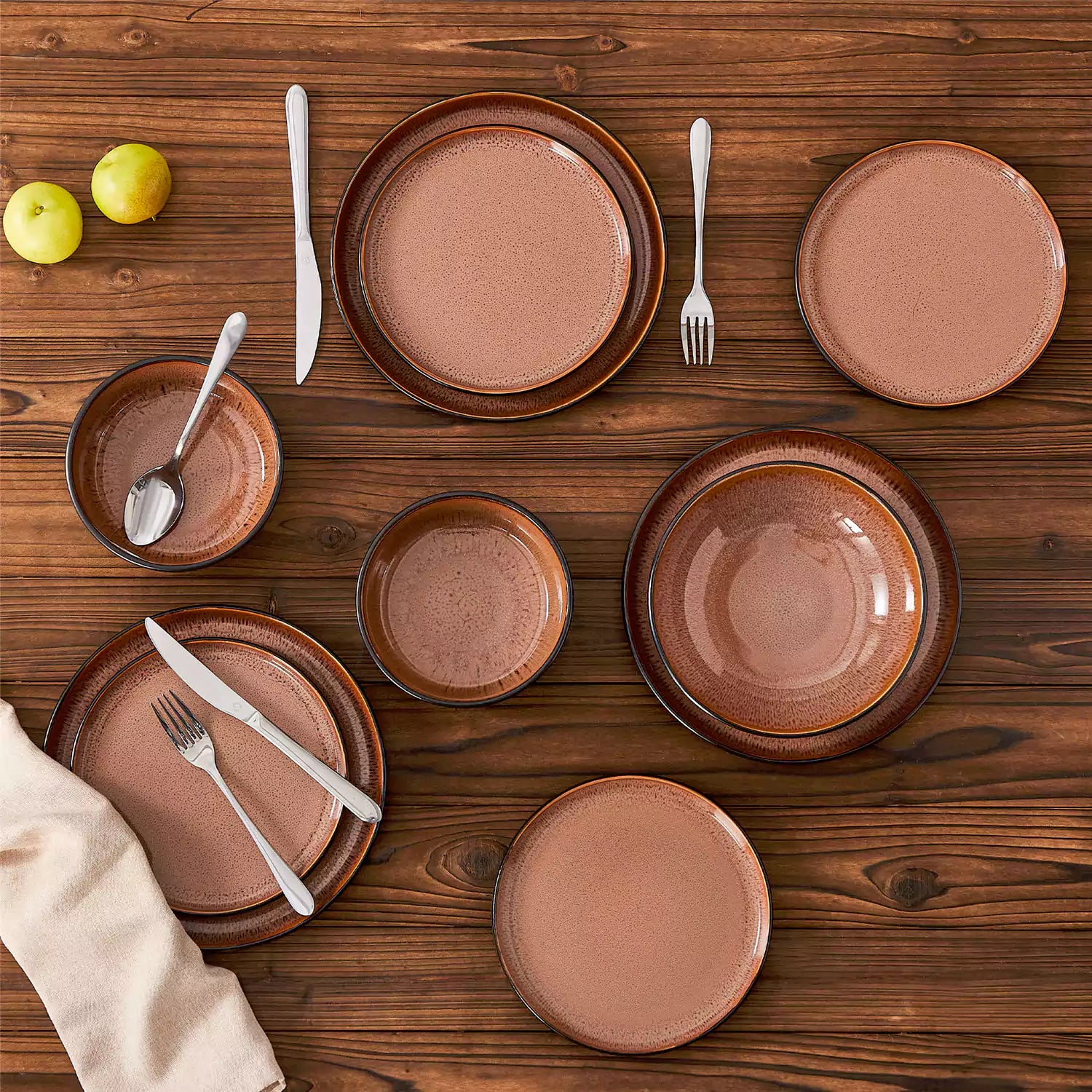 Assorted dishes with soup - dessert - and fruit salad on rustic wooden table - Amber 16-Piece red stoneware dinnerware set with plates and bowls by vancasso