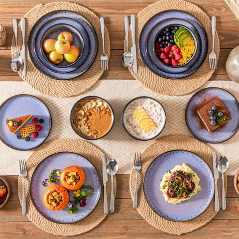 Rustic dining table with Amber 12-piece stoneware dinnerware in farmhouse violet - featuring reactive glaze plates - bowls - and utensils by vancasso