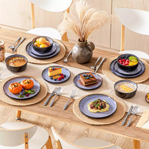 Rustic dining table with Amber 12-piece stoneware dinnerware in farmhouse violet - featuring reactive glaze plates - bowls - and utensils by vancasso