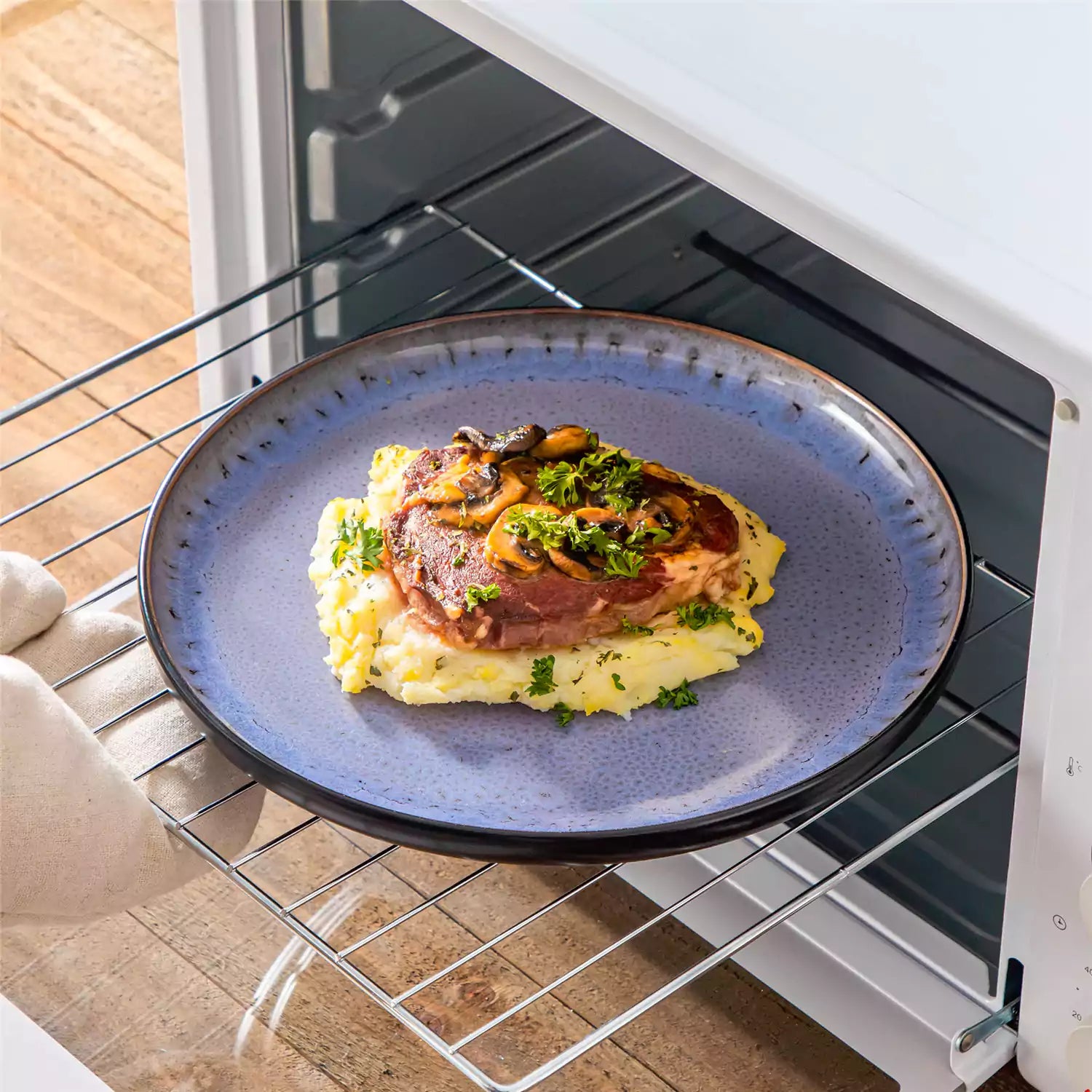 Rustic dining table with Amber 12-piece stoneware dinnerware in farmhouse violet - featuring reactive glaze plates - bowls - and utensils by vancasso