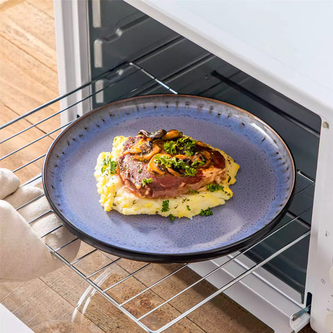 Rustic dining table with Amber 12-piece stoneware dinnerware in farmhouse violet - featuring reactive glaze plates - bowls - and utensils by vancasso