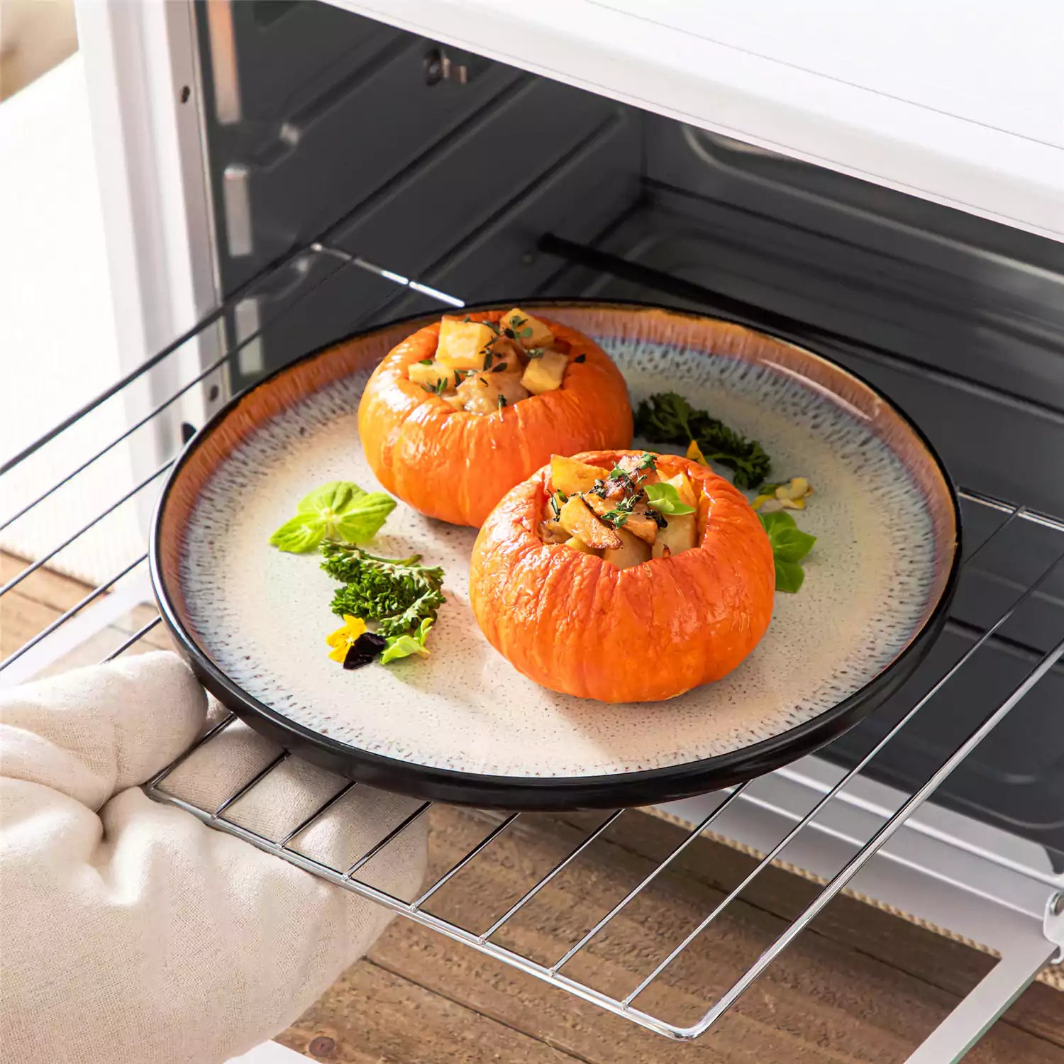 Rustic dining table with Amber 12-piece stoneware dinnerware in farmhouse beige - featuring reactive glaze plates - bowls - and utensils by vancasso