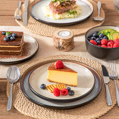 Rustic dining table with Amber 12-piece stoneware dinnerware in farmhouse beige - featuring reactive glaze plates - bowls - and utensils by vancasso