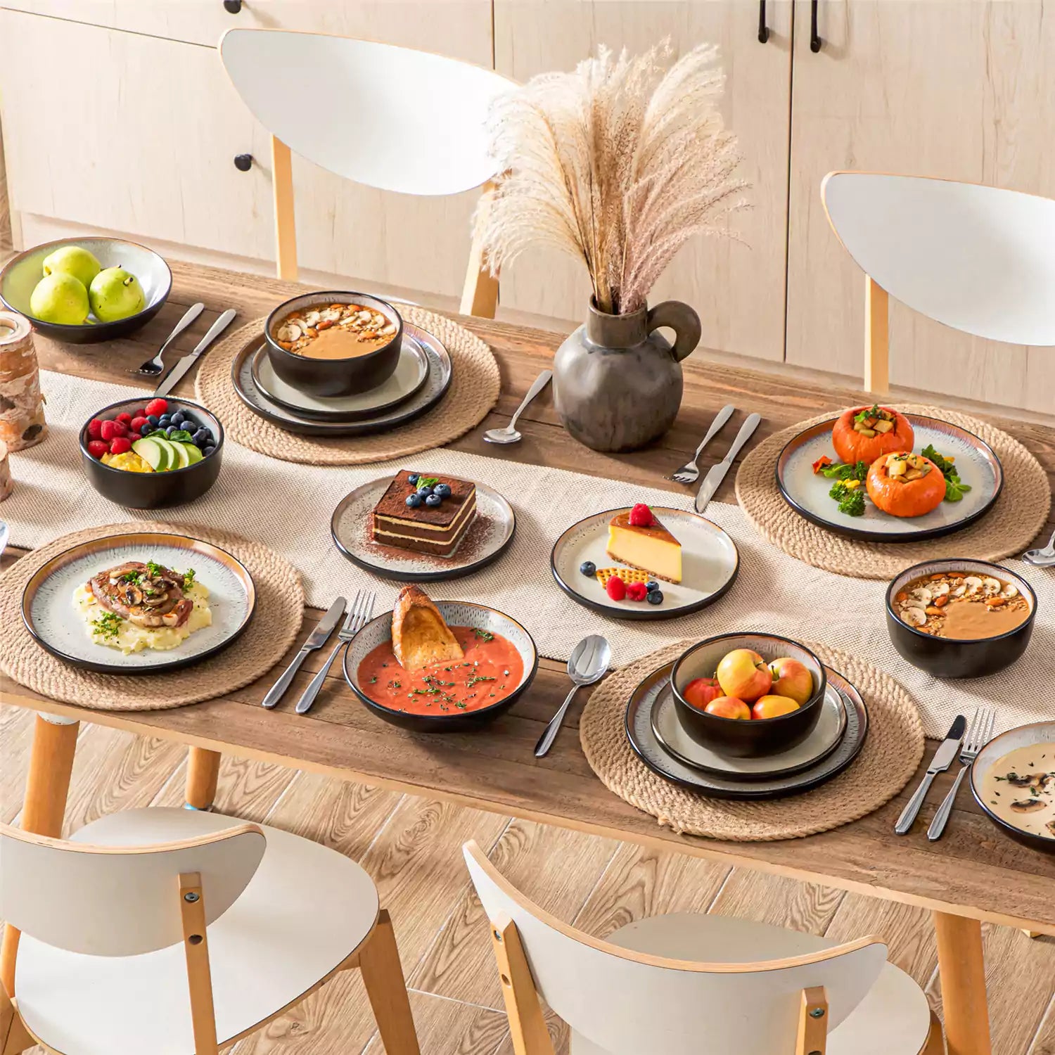 Assorted dishes with soup - dessert - and fruit salad on rustic wooden table - Amber 16-Piece beige stoneware dinnerware set with plates and bowls by vancasso
