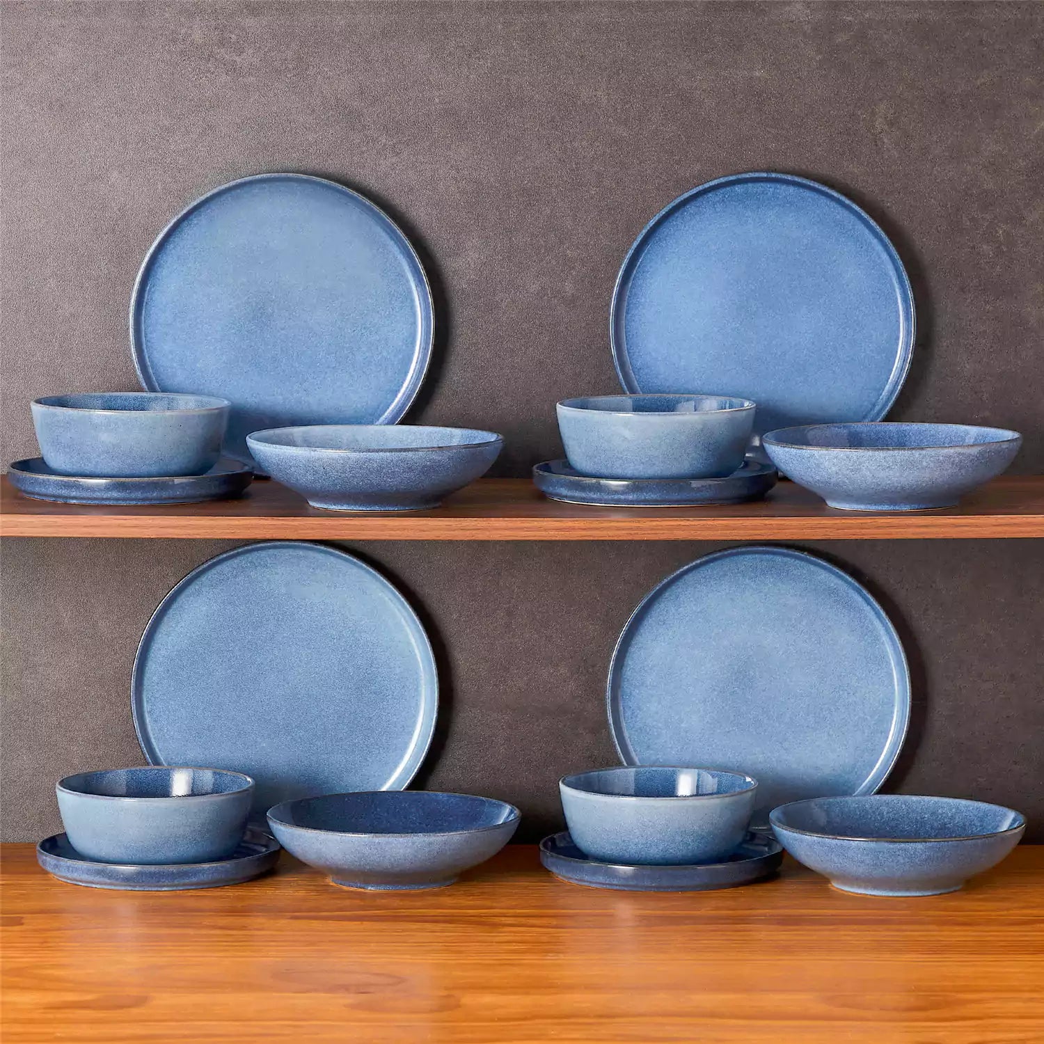 Handcrafted blue stoneware with reactive glaze on woven placemats - perfect for farmhouse tables