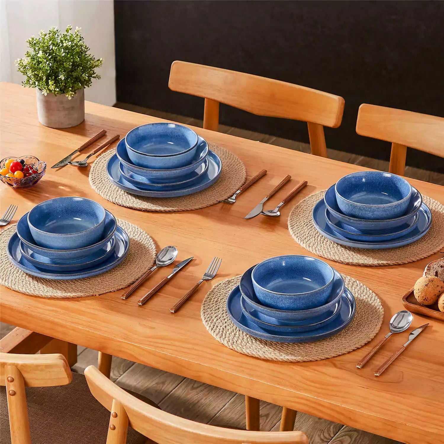 Handcrafted blue stoneware with reactive glaze on woven placemats - perfect for farmhouse tables