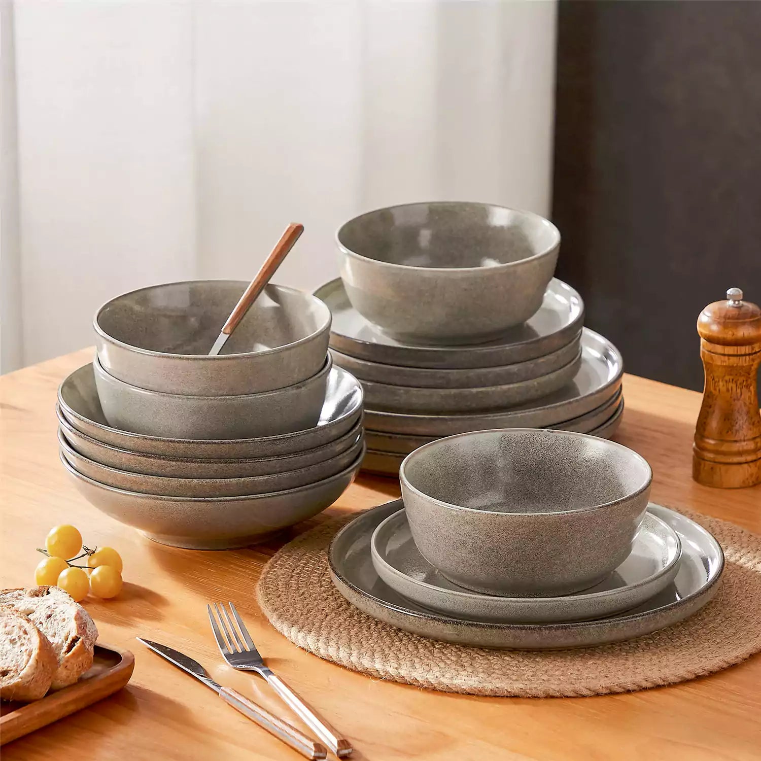 Handcrafted brown stoneware with reactive glaze on woven placemats - perfect for farmhouse tables