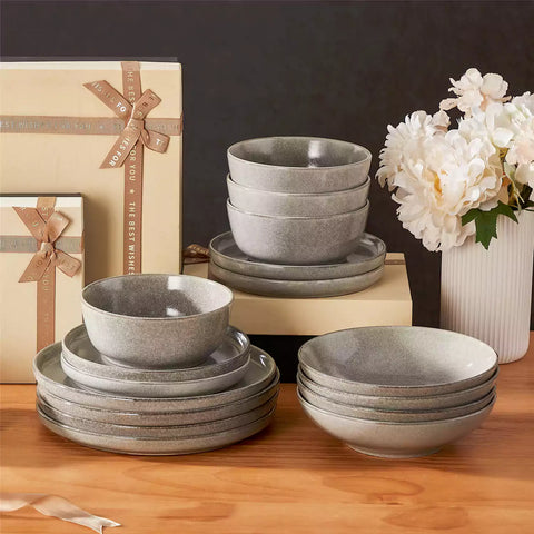 Handcrafted brown stoneware with reactive glaze on woven placemats - perfect for farmhouse tables
