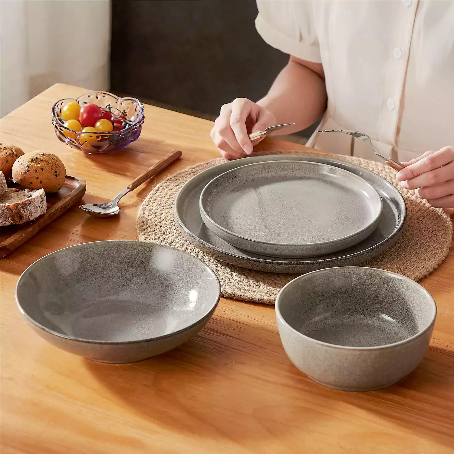 Handcrafted brown stoneware with reactive glaze on woven placemats - perfect for farmhouse tables