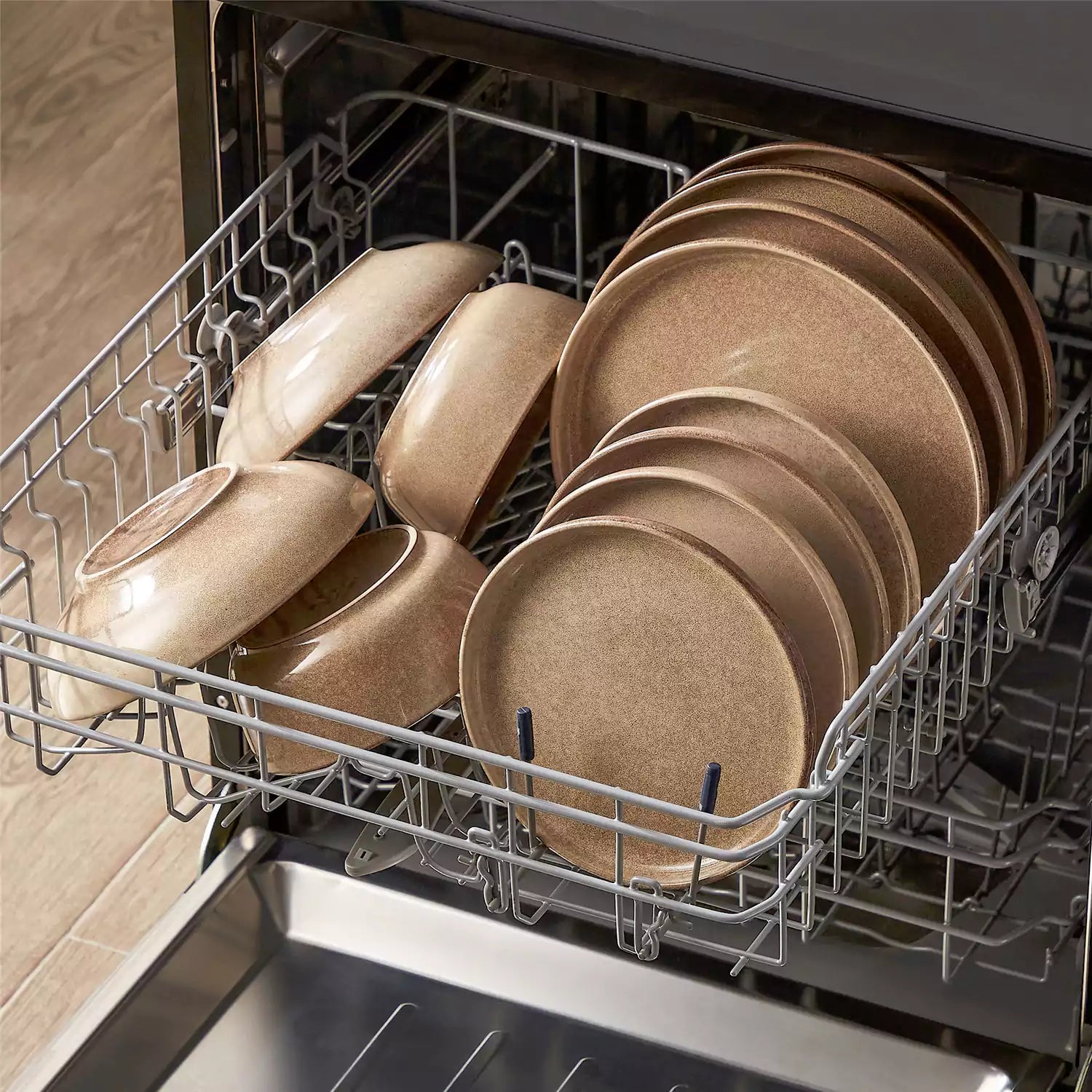 Handcrafted caramel stoneware with reactive glaze on woven placemats - perfect for farmhouse tables